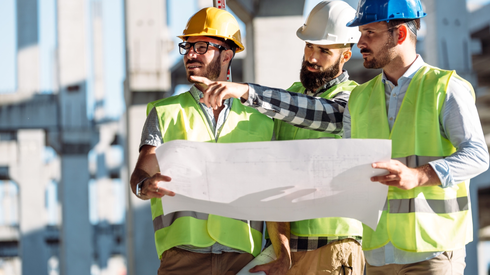 Portrait of construction engineers working on building site
